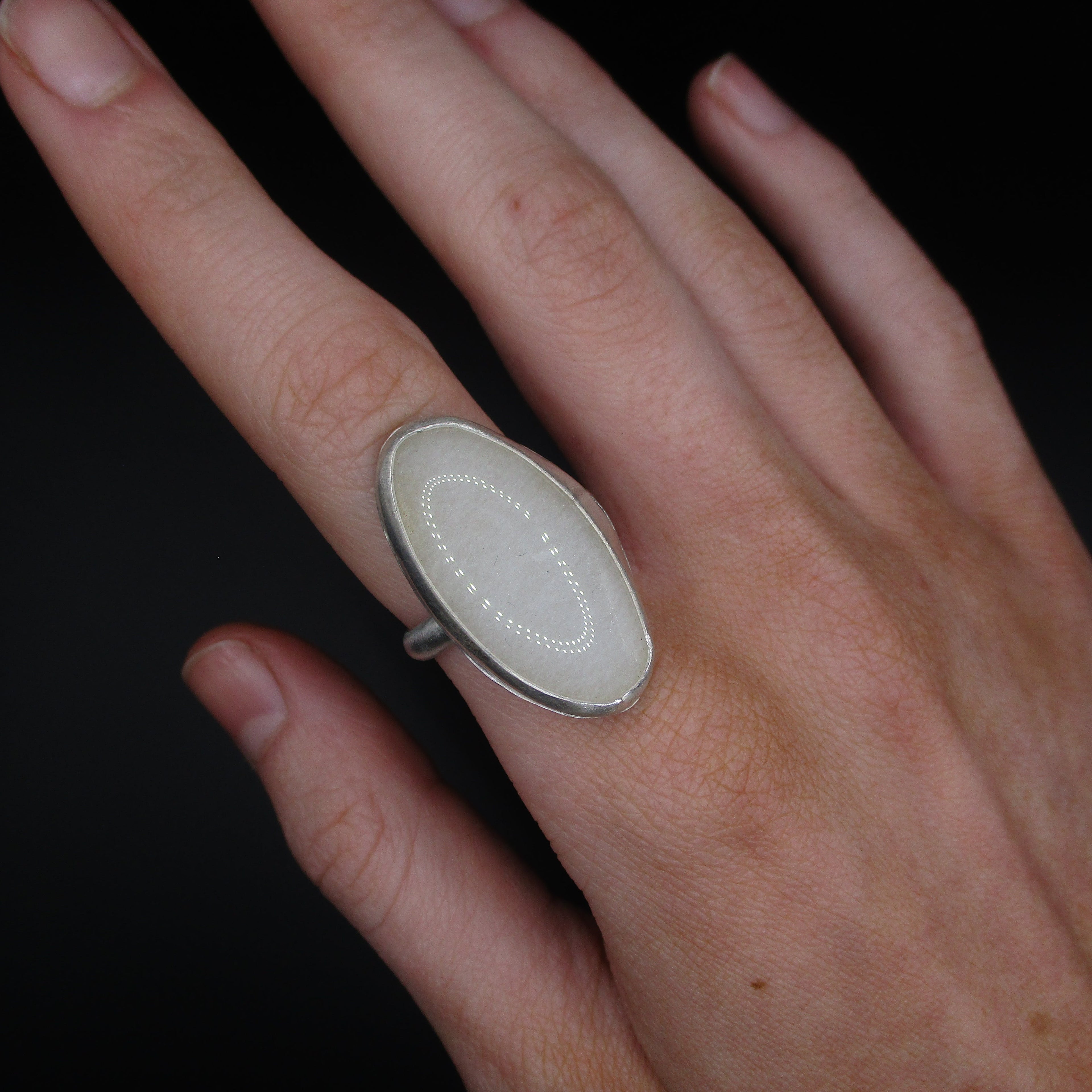 white oval ring